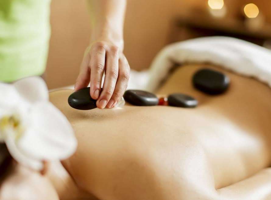 Massage with hot stones
